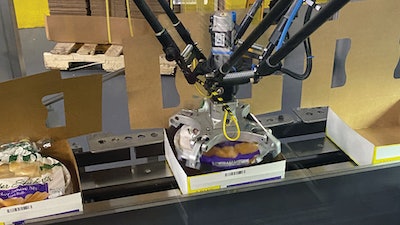 For twin-pack cartons, the delta style robot picks bagged pans from the conveyor belt in the foreground, rotates them so that the ponytail is in the 12 o’clock position, and places them into a carton that is erected from a flat blank upstream.