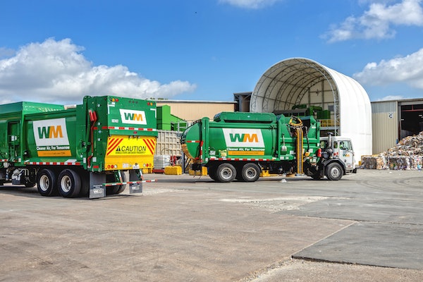Haulers feed the tipping floor at WM's new Houston West Side material recovery facility (MRF).