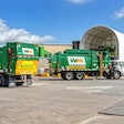 Haulers feed the tipping floor at WM's new Houston West Side material recovery facility (MRF).